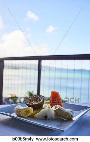 Fresh tropical breakfast fruit plate, with mango, papaya, banana and passion fruit, overlooking the water, Saint Lucia, Caribbean View Large Photo Image Stock Photo - Fresh tropical breakfast fruit plate, with mango, papaya, banana and passion fruit, overlooking the water, Saint Lucia, Caribbean. Fotosearch
