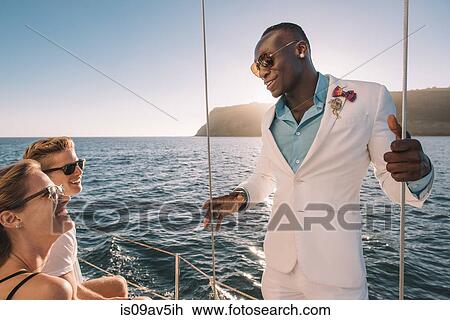 Friends chatting on sailboat, San Diego Bay, California, USA View Large Photo Image Stock Image - Friends chatting on sailboat, San Diego Bay, California, USA. Fotosearch