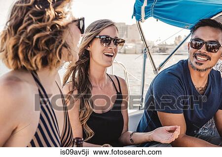 Friends chatting on sailboat, San Diego Bay, California, USA View Large Photo Image Stock Image - Friends chatting on sailboat, San Diego Bay, California, USA. Fotosearch