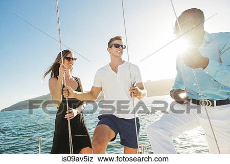 Friends chatting on sailboat, San Diego Bay, California, USA View Large Photo Image Stock Photo - Friends chatting on sailboat, San Diego Bay, California, USA. Fotosearch