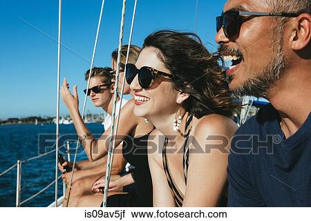 Friends enjoying view on sailboat, San Diego Bay, California, USA View Large Photo Image Stock Image - Friends enjoying view on sailboat, San Diego Bay, California, USA. Fotosearch