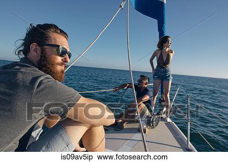 Friends enjoying view on sailboat, San Diego Bay, California, USA View Large Photo Image Stock Photography - Friends enjoying view on sailboat, San Diego Bay, California, USA. Fotosearch