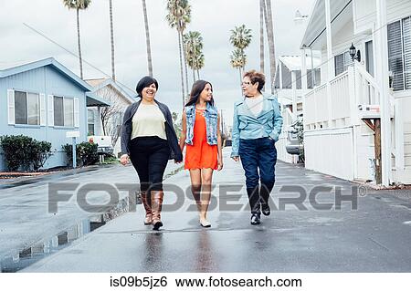 Full length front view of multi generation family walking in street holding hands View Large Photo Image Stock Photograph - Full length front view of multi generation family walking in street holding hands. Fotosearch