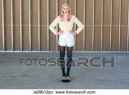 Full length image of woman, hands on hips looking at camera View Large Photo Image Stock Image - Full length image of woman, hands on hips looking at camera. Fotosearch