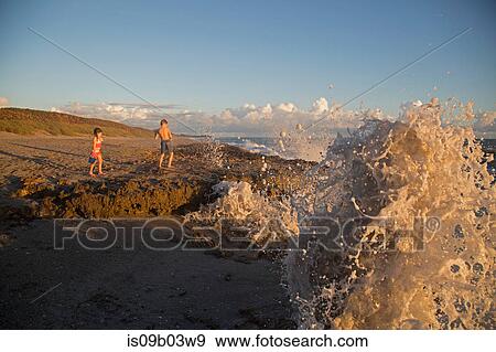 Girl and brother watching ocean waves, Blowing Rocks Preserve, Jupiter Island, Florida, USA View Large Photo Image Stock Photo - Girl and brother watching ocean waves, Blowing Rocks Preserve, Jupiter Island, Florida, USA. Fotosearch