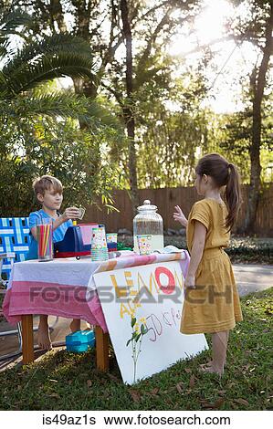 Girl buying lemonade from lemonade stand in garden View Large Photo Image Stock Photograph - Girl buying lemonade from lemonade stand in garden. Fotosearch