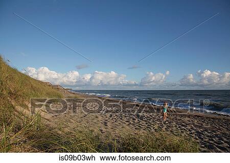 Girl playing on beach, Blowing Rocks Preserve, Jupiter Island, Florida, USA View Large Photo Image Stock Image - Girl playing on beach, Blowing Rocks Preserve, Jupiter Island, Florida, USA. Fotosearch