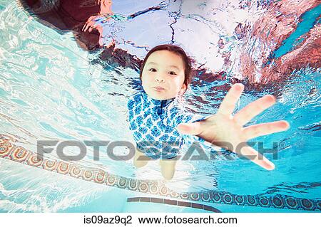 Girl underwater in swimming pool View Large Photo Image Stock Image - Girl underwater in swimming pool. Fotosearch