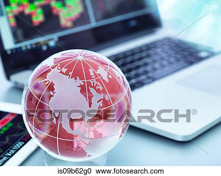 Globe with digital tablet and laptop showing international business trade View Large Photo Image Stock Image - Globe with digital tablet and laptop showing international business trade. Fotosearch