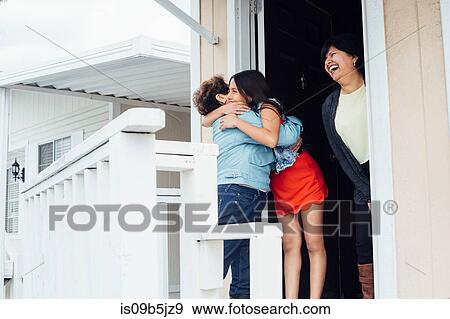 Grandmother and granddaughter on porch hugging View Large Photo Image Stock Photo - Grandmother and granddaughter on porch hugging. Fotosearch