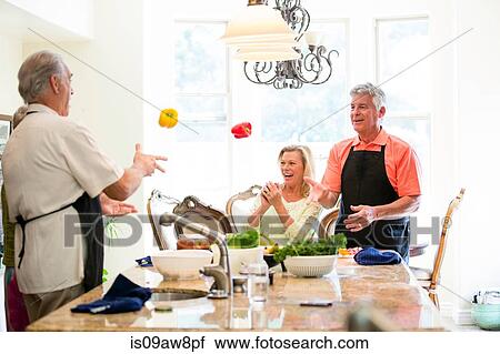 Group of seniors having fun in kitchen View Large Photo Image Stock Image - Group of seniors having fun in kitchen. Fotosearch