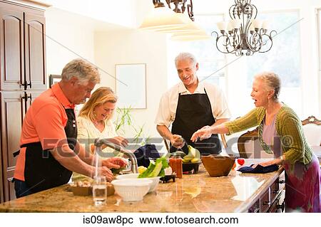 Group of seniors preparing meal in kitchen View Large Photo Image Stock Image - Group of seniors preparing meal in kitchen. Fotosearch
