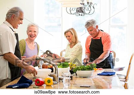 Group of seniors preparing meal in kitchen View Large Photo Image Stock Image - Group of seniors preparing meal in kitchen. Fotosearch