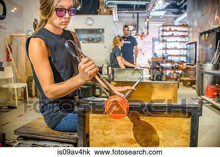 Group of young adults blowing glass View Large Photo Image Stock Image - Group of young adults blowing glass. Fotosearch