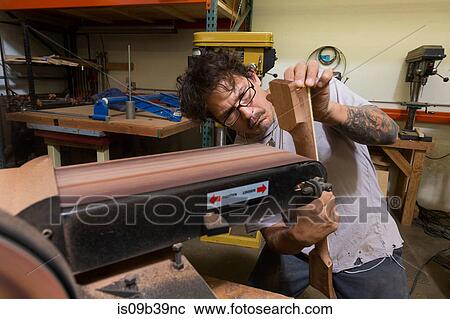 Guitar maker manufacturing guitar in workshop View Large Photo Image Stock Image - Guitar maker manufacturing guitar in workshop. Fotosearch