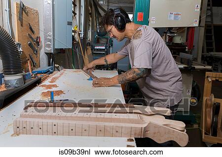 Guitar maker manufacturing guitar in workshop View Large Photo Image Stock Image - Guitar maker manufacturing guitar in workshop. Fotosearch