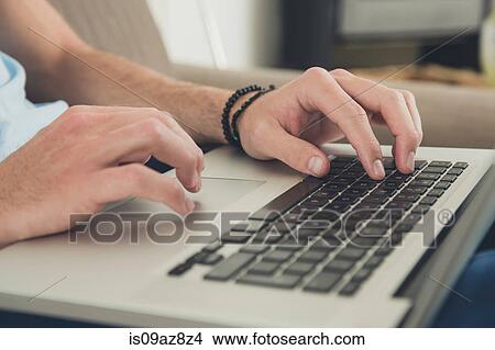 Hands of man using laptop View Large Photo Image Picture - Hands of man using laptop. Fotosearch