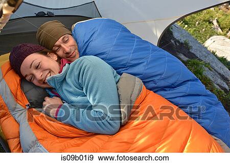 Happy couple in sleeping bags in tent at Fault Lake, Selkirk Mountains, Idaho View Large Photo Image Stock Photo - Happy couple in sleeping bags in tent at Fault Lake, Selkirk Mountains, Idaho. Fotosearch