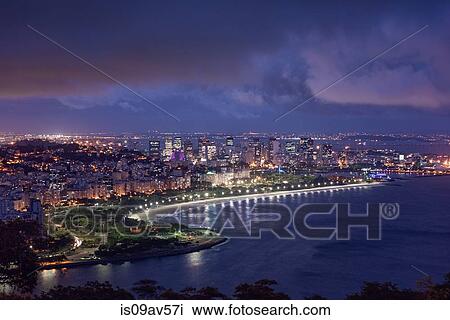Stock Image - High angle view of bay illuminated at night, Rio de Janeiro, Brazil. Fotosearch