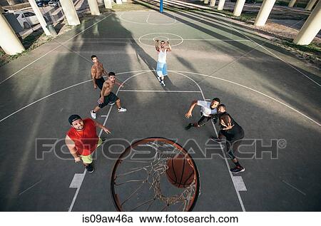 High angle view of men on basketball court watching basketball going through basketball hoop View Large Photo Image Stock Image - High angle view of men on basketball court watching basketball going through basketball hoop. Fotosearch