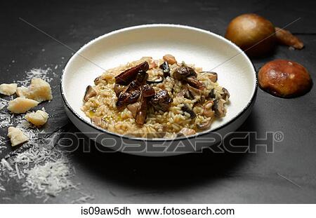 High angle view of mushroom risotto in shallow bowl View Large Photo Image Stock Image - High angle view of mushroom risotto in shallow bowl. Fotosearch