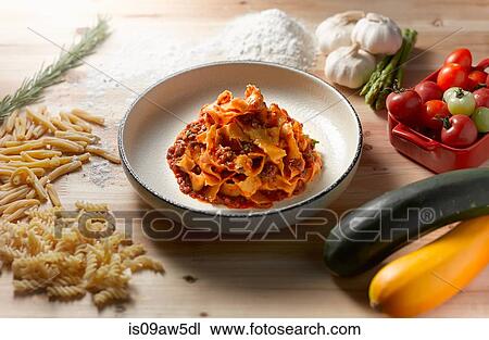 High angle view of tagliatelle bolognese in shallow bowl View Large Photo Image Stock Image - High angle view of tagliatelle bolognese in shallow bowl. Fotosearch