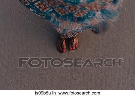 High angle view of woman's feet on sand View Large Photo Image Stock Image - High angle view of woman's feet on sand. Fotosearch