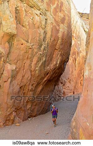 Hiker exploring Little Wild Horse and Bell Canyon Loop, Goblin Valley State Park, San Rafael Swell, Utah View Large Photo Image Stock Image - Hiker exploring Little Wild Horse and Bell Canyon Loop, Goblin Valley State Park, San Rafael Swell, Utah. Fotosearch