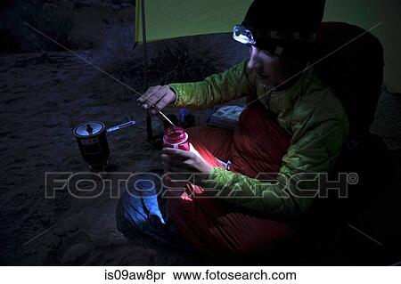 Hiker having meal at camp in desert View Large Photo Image Stock Photography - Hiker having meal at camp in desert. Fotosearch