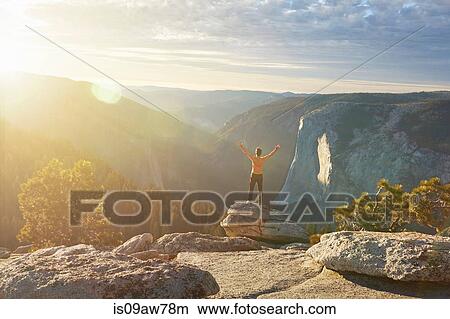 Hiker rejoicing on hill, Yosemite National Park, Sierra Nevada View Large Photo Image Picture - Hiker rejoicing on hill, Yosemite National Park, Sierra Nevada. Fotosearch