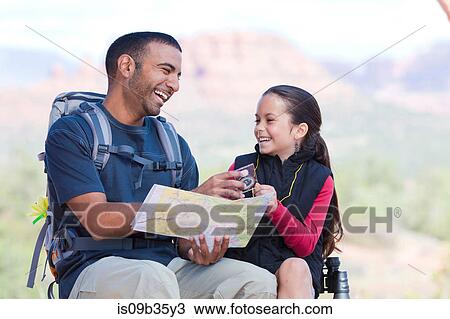 Hiking girl and young man looking at map, Sedona, Arizona, USA View Large Photo Image Stock Image - Hiking girl and young man looking at map, Sedona, Arizona, USA. Fotosearch