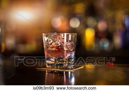 Iced drink in tumbler on public house counter View Large Photo Image Stock Image - Iced drink in tumbler on public house counter. Fotosearch