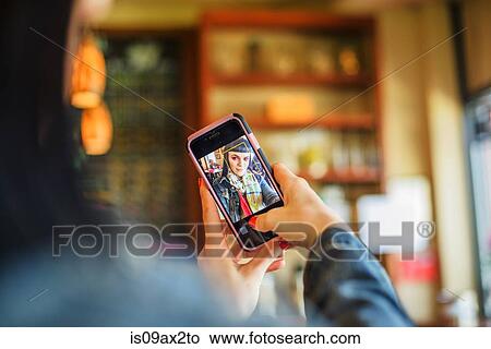 Image on smartphone of woman taking selfie View Large Photo Image Picture - Image on smartphone of woman taking selfie. Fotosearch