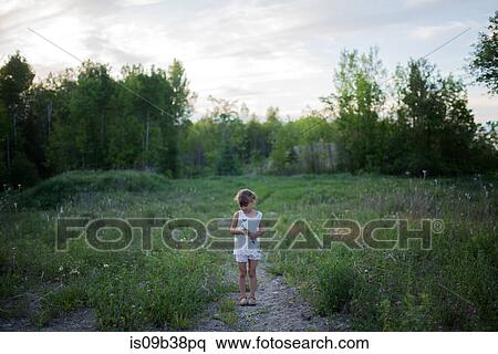 Little girl on grass field, Vancouver, British Columbia, Canada View Large Photo Image Stock Photography - Little girl on grass field, Vancouver, British Columbia, Canada. Fotosearch