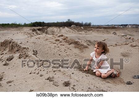 Little girl playing on beach, Vancouver, British Columbia, Canada View Large Photo Image Picture - Little girl playing on beach, Vancouver, British Columbia, Canada. Fotosearch