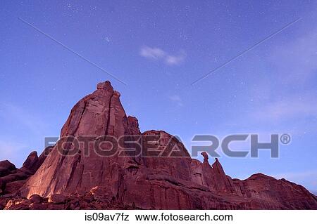 Low angle view of starry sky and rock formations at night, Moab, Utah, USA View Large Photo Image Stock Photo - Low angle view of starry sky and rock formations at night, Moab, Utah, USA. Fotosearch