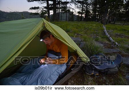 Male camper in sleeping bag writing his journal at dusk on Midnight Ridge, Colville National Forest, Washington State, USA View Large Photo Image Stock Photography - Male camper in sleeping bag writing his journal at dusk on Midnight Ridge, Colville National Forest, Washington State, USA. Fotosearch