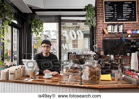 Male employee in cafe, New York, USA View Large Photo Image Stock Image - Male employee in cafe, New York, USA. Fotosearch