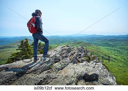 Male hiker looking out from ridge, Blue Ridge Mountains, North Carolina, USA View Large Photo Image Stock Image - Male hiker looking out from ridge, Blue Ridge Mountains, North Carolina, USA. Fotosearch
