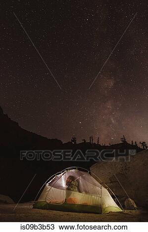 Male hiker looking out through tent at night sky, Mineral King, Sequoia National Park, California, USA View Large Photo Image Stock Image - Male hiker looking out through tent at night sky, Mineral King, Sequoia National Park, California, USA. Fotosearch