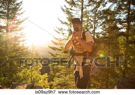 Male hiker taking smartphone selfie on forest ridge, Mount Hood National Forest, Oregon, USA View Large Photo Image Stock Photo - Male hiker taking smartphone selfie on forest ridge, Mount Hood National Forest, Oregon, USA. Fotosearch