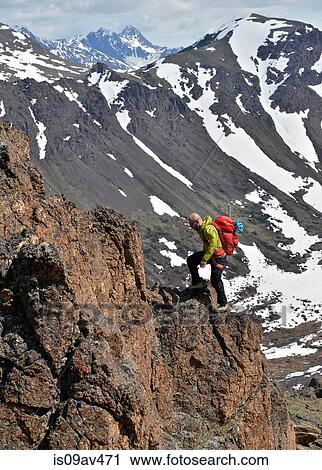 Male mountain climber climbing steep mountain, Chugach State Park, Anchorage, Alaska, USA View Large Photo Image Stock Image - Male mountain climber climbing steep mountain, Chugach State Park, Anchorage, Alaska, USA. Fotosearch