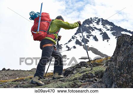 Male mountain climber walking uphill, rear view, Chugach State Park, Anchorage, Alaska, USA View Large Photo Image Stock Image - Male mountain climber walking uphill, rear view, Chugach State Park, Anchorage, Alaska, USA. Fotosearch