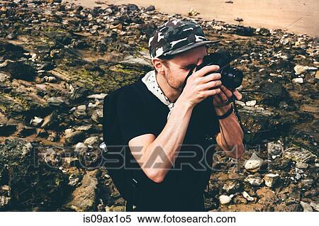 Male photographer photographing on beach, Crystal Cove State Park, Laguna Beach, California, USA View Large Photo Image Stock Photography - Male photographer photographing on beach, Crystal Cove State Park, Laguna Beach, California, USA. Fotosearch