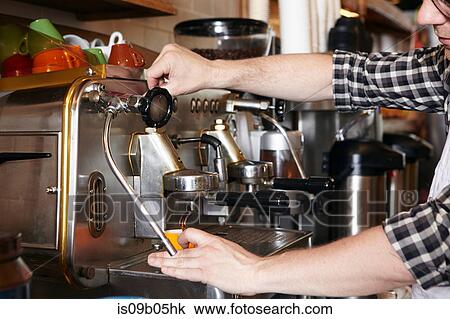 Male worker in bakery, using coffee machine, close-up View Large Photo Image Stock Image - Male worker in bakery, using coffee machine, close-up. Fotosearch