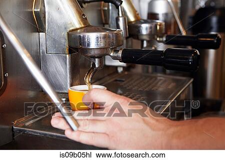 Male worker in bakery, using coffee machine, close-up View Large Photo Image Stock Image - Male worker in bakery, using coffee machine, close-up. Fotosearch