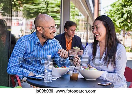 Man and woman having lunch outside cafe View Large Photo Image Stock Image - Man and woman having lunch outside cafe. Fotosearch