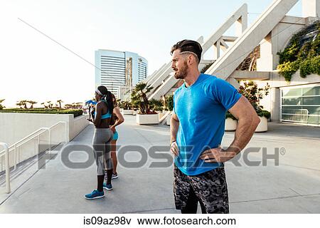 Man and women training, taking a break at sport facility, downtown San Diego, California, USA View Large Photo Image Stock Photo - Man and women training, taking a break at sport facility, downtown San Diego, California, USA. Fotosearch
