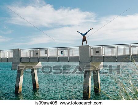 Man doing handstand on bridge, South Pointe Park, South Beach, Miami, Florida, USA View Large Photo Image Stock Photography - Man doing handstand on bridge, South Pointe Park, South Beach, Miami, Florida, USA. Fotosearch