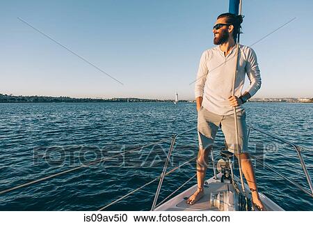 Man enjoying view on sailboat, San Diego Bay, California, USA View Large Photo Image Stock Image - Man enjoying view on sailboat, San Diego Bay, California, USA. Fotosearch